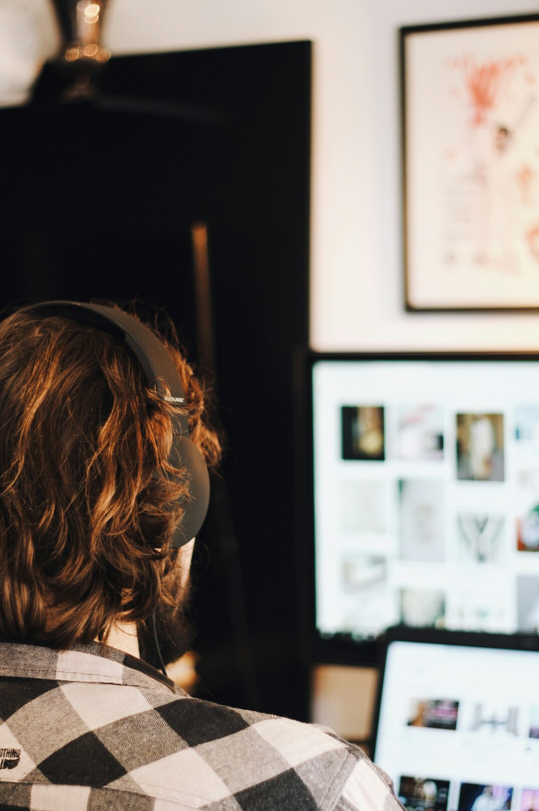person editing video at desk